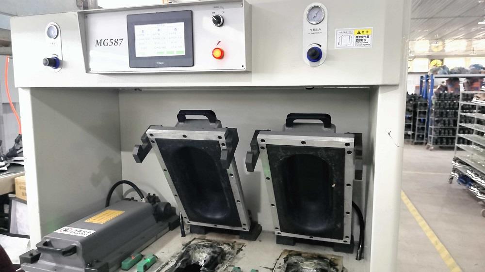 Compression molding machine for shoe midsole production at Lento