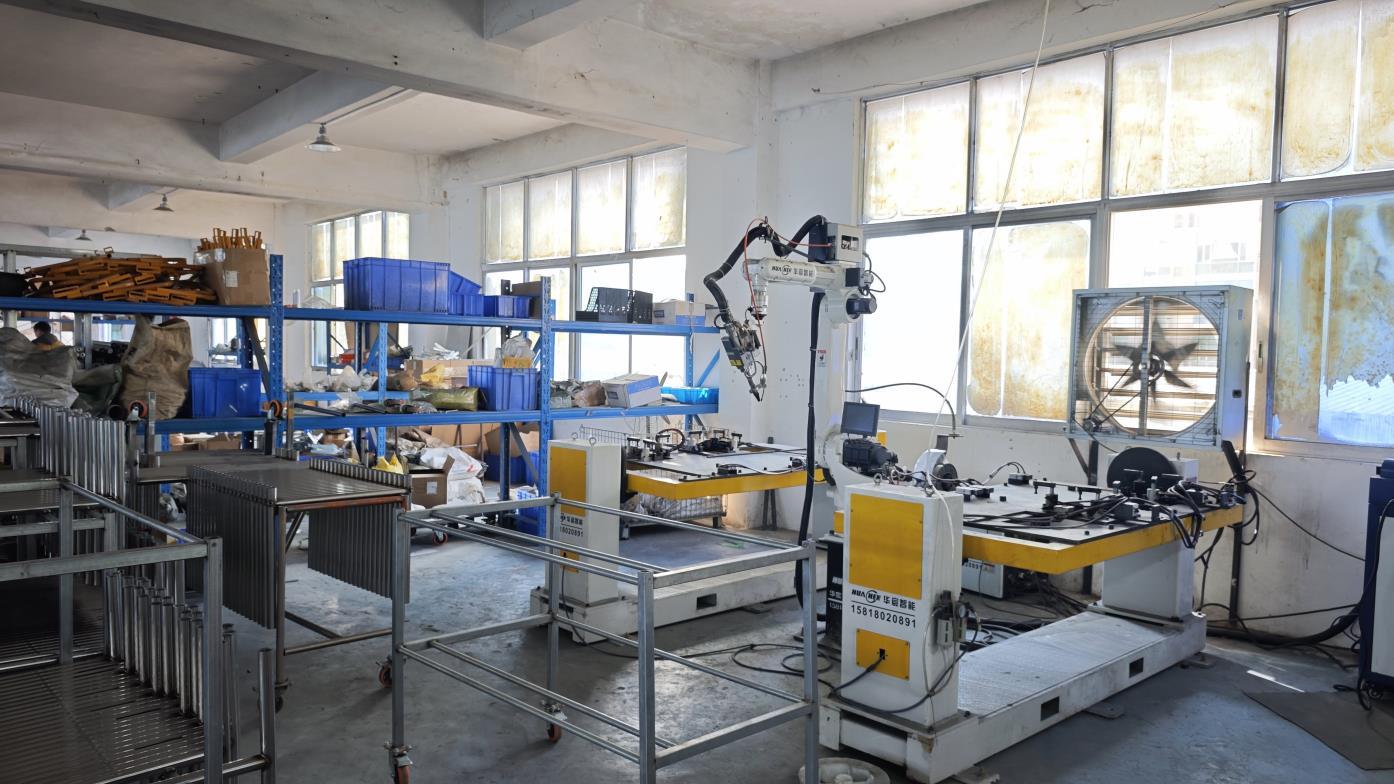Automatic robotic arm spot welding machine for warehouse system production