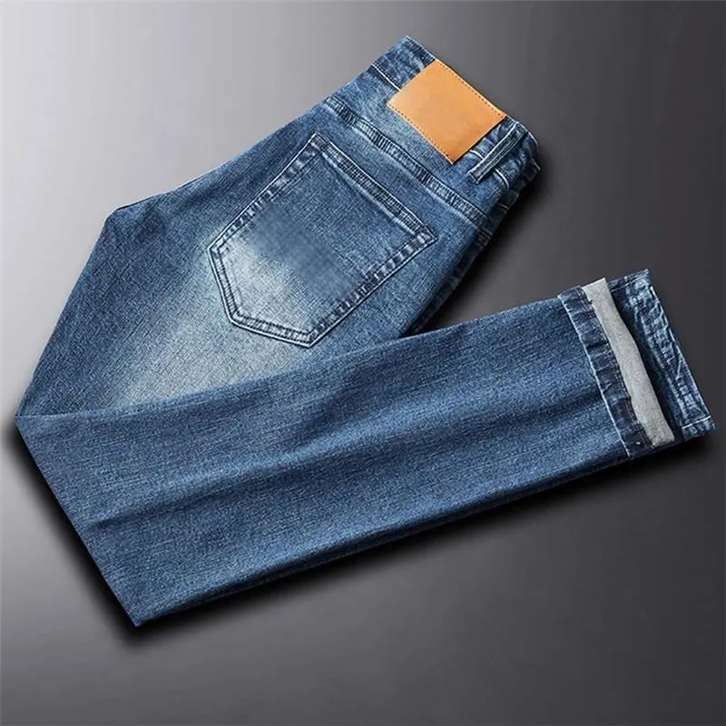 Calças Jeans Masculinas Slimming de Tecido Denim Stretch com Corte Reto e Estilo Casual de Negócios Desgastadas