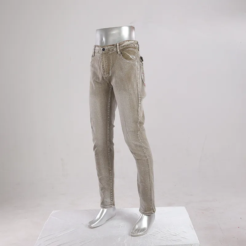 Jeans retos de cinco bolsos em denim marrom de cintura baixa e desbotado para homens