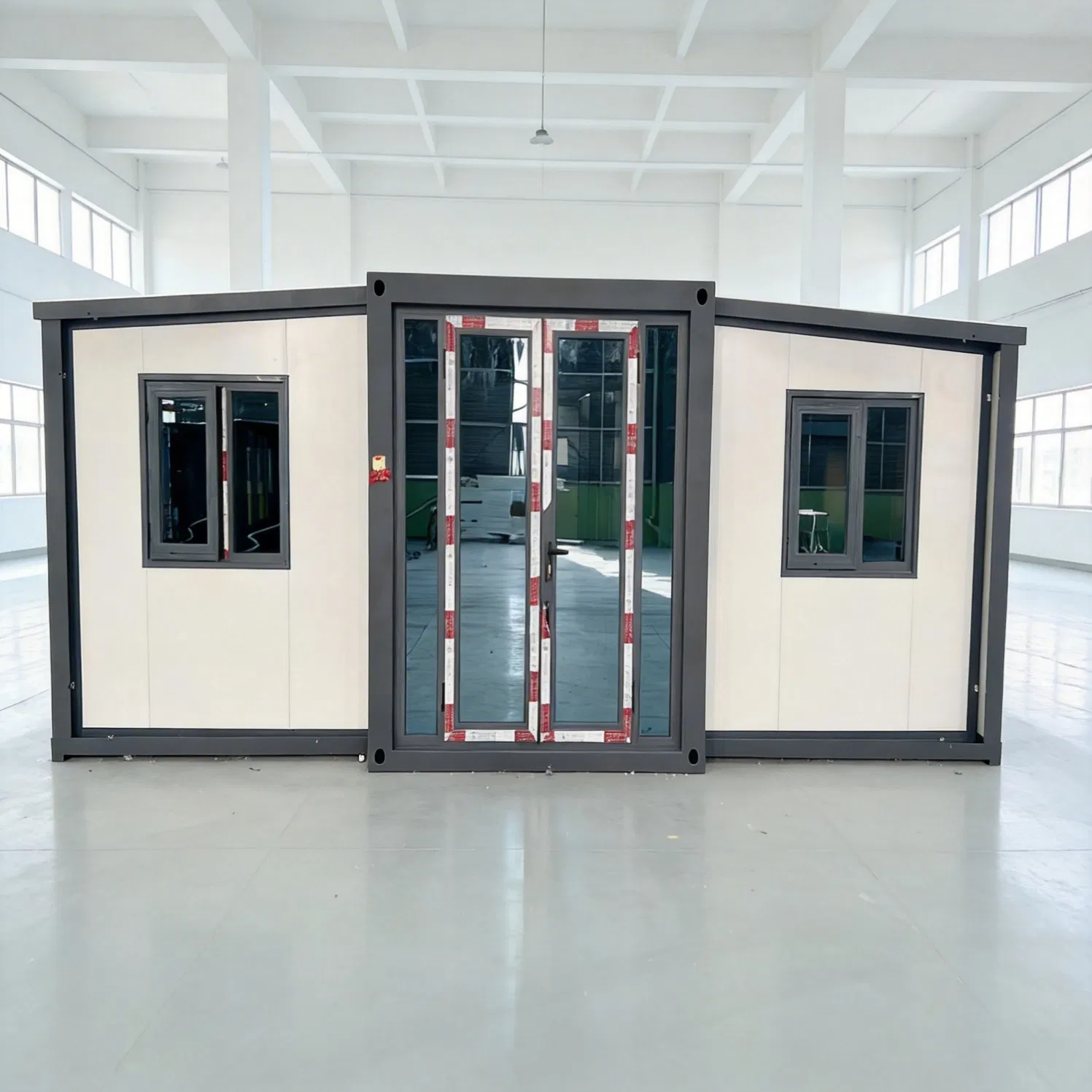 Expandable Twenty Foot Twin Wing Shipping Unit with EPS Load Bearing Roof and Double Glazed Windows for Comfort
