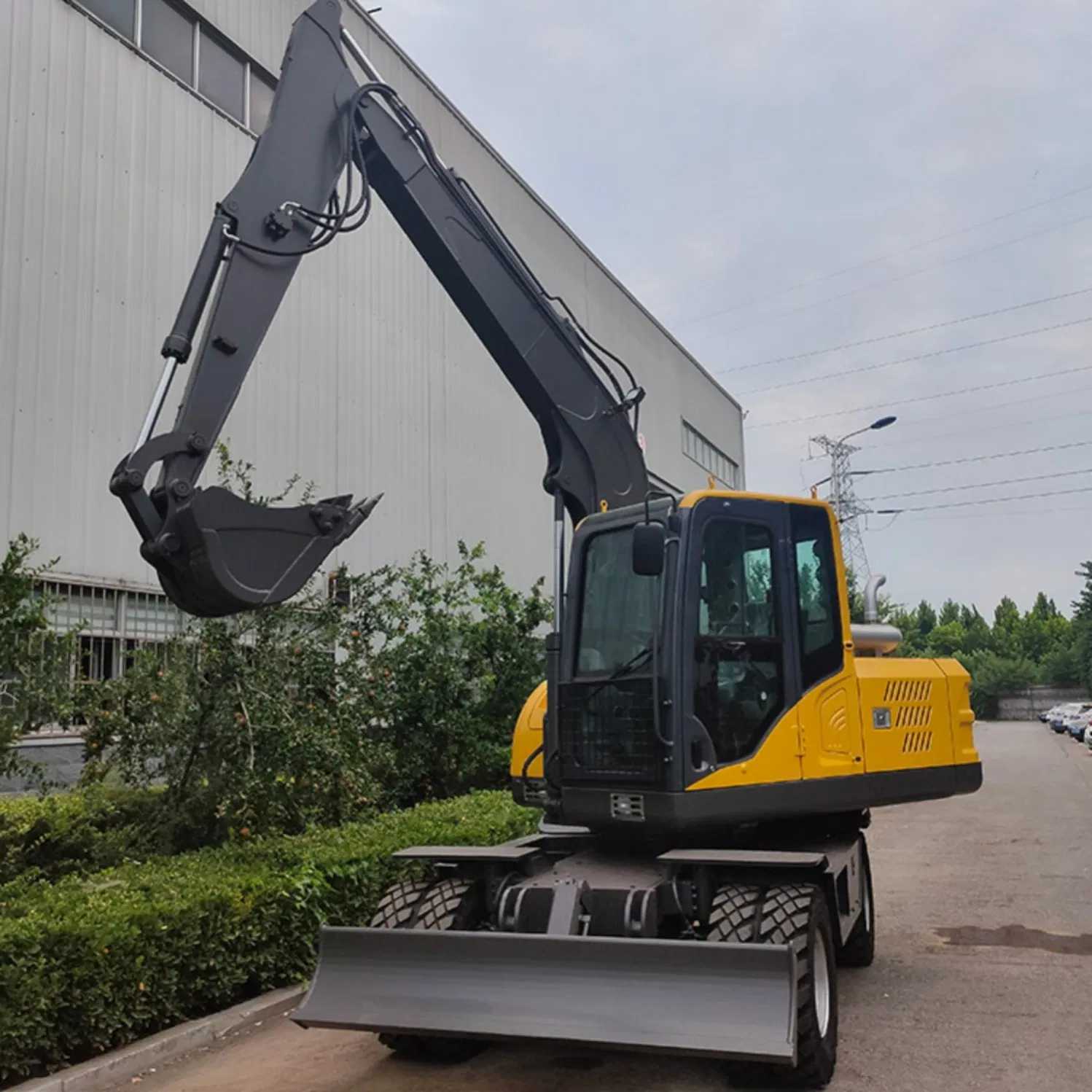 Versatile Model 100 Wheel Excavator with Demolition Hammer for Breaking Concrete