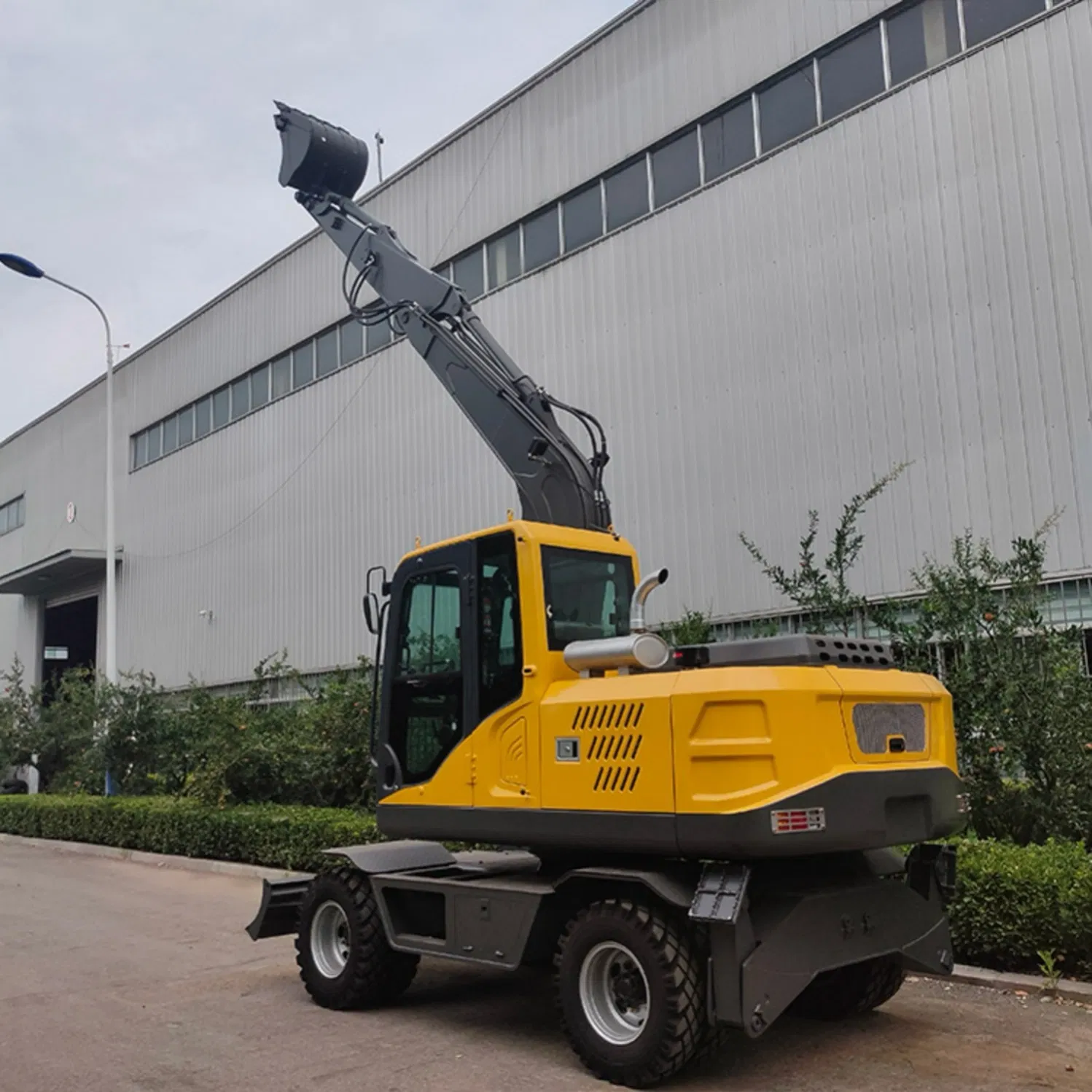 Versatile Model 100 Wheel Excavator with Demolition Hammer for Breaking Concrete