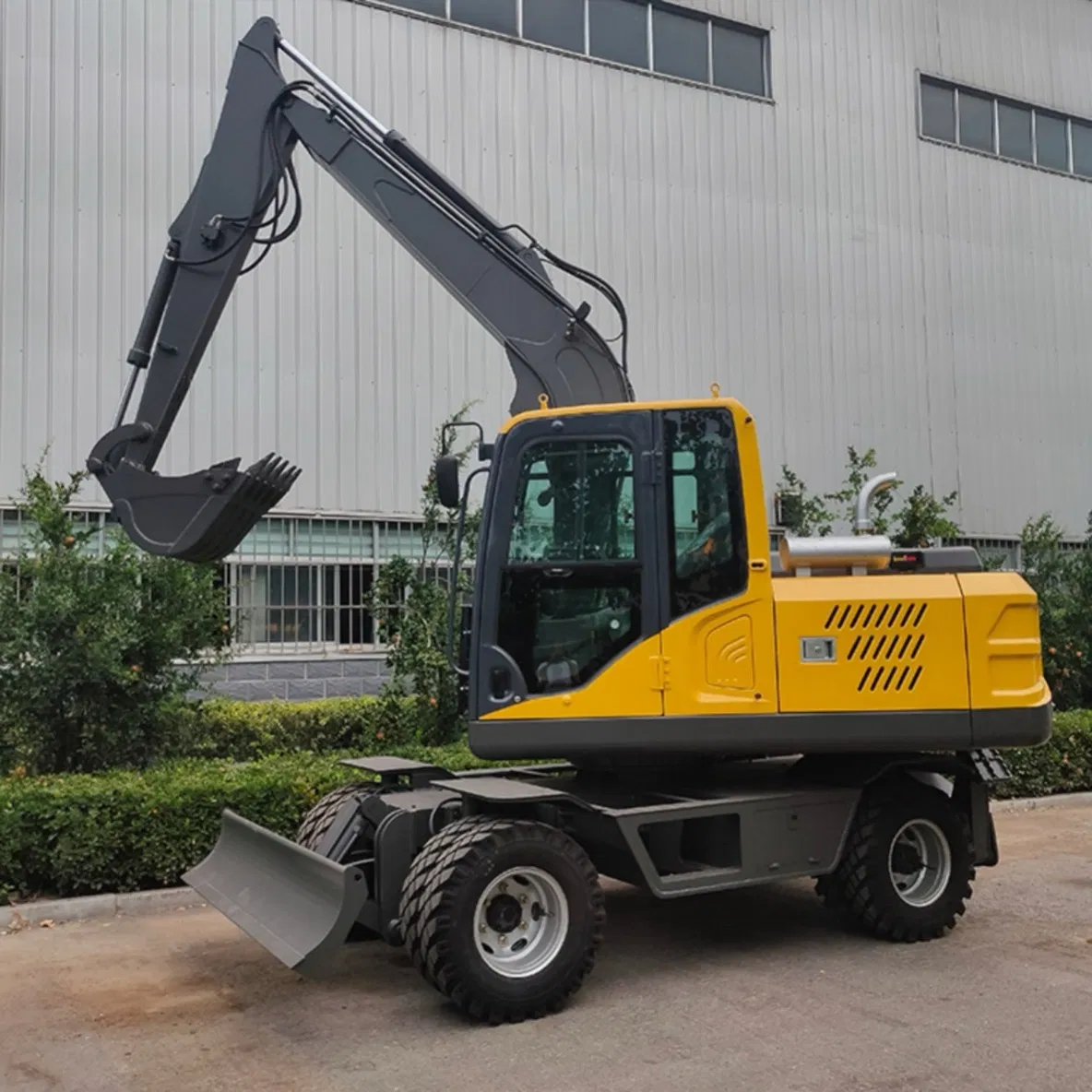 Versatile Model 100 Wheel Excavator with Demolition Hammer for Breaking Concrete