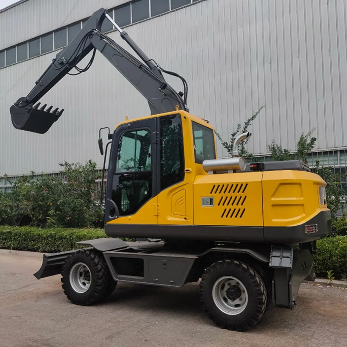 Versatile Model 100 Wheel Excavator with Demolition Hammer for Breaking Concrete