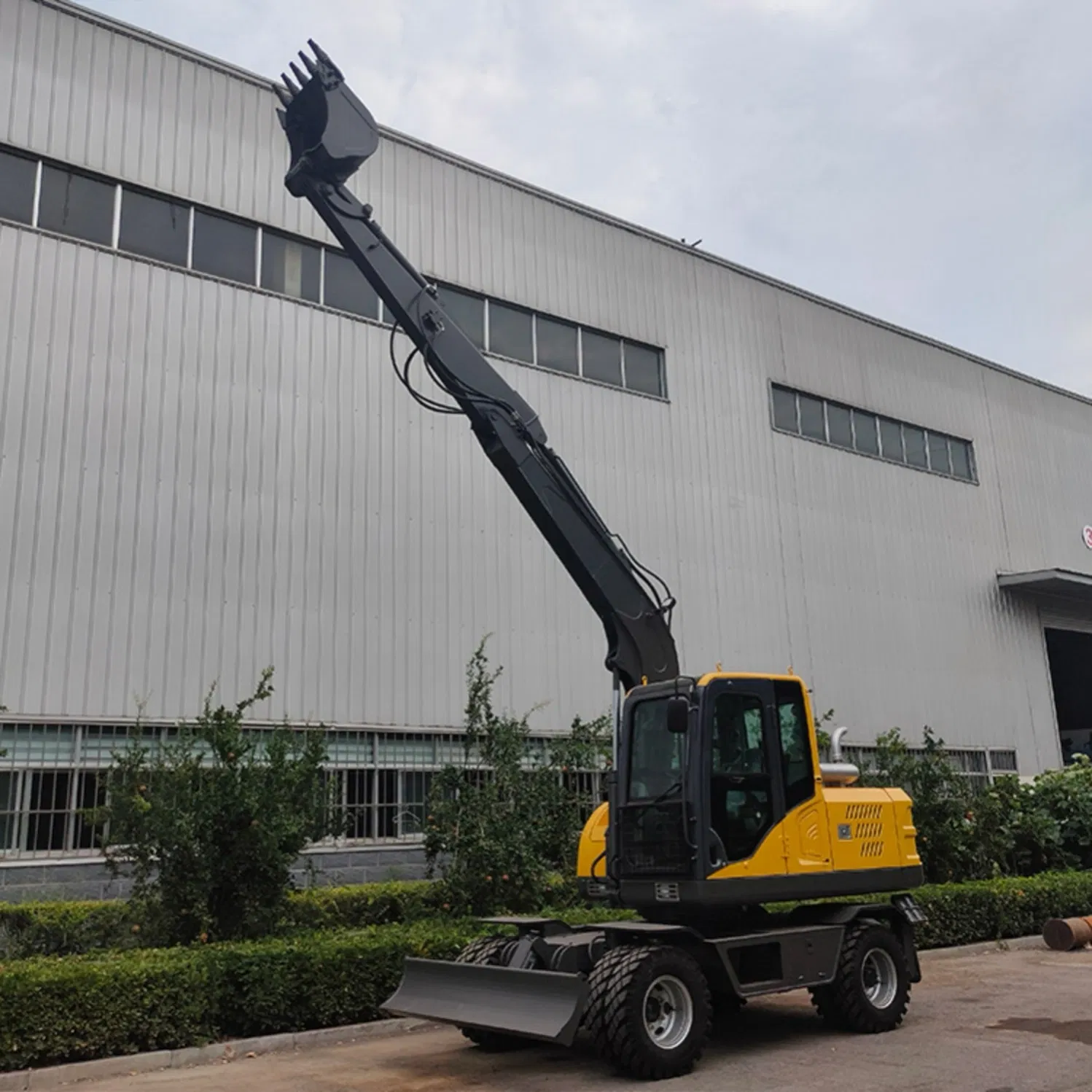 Versatile Model 100 Wheel Excavator with Demolition Hammer for Breaking Concrete