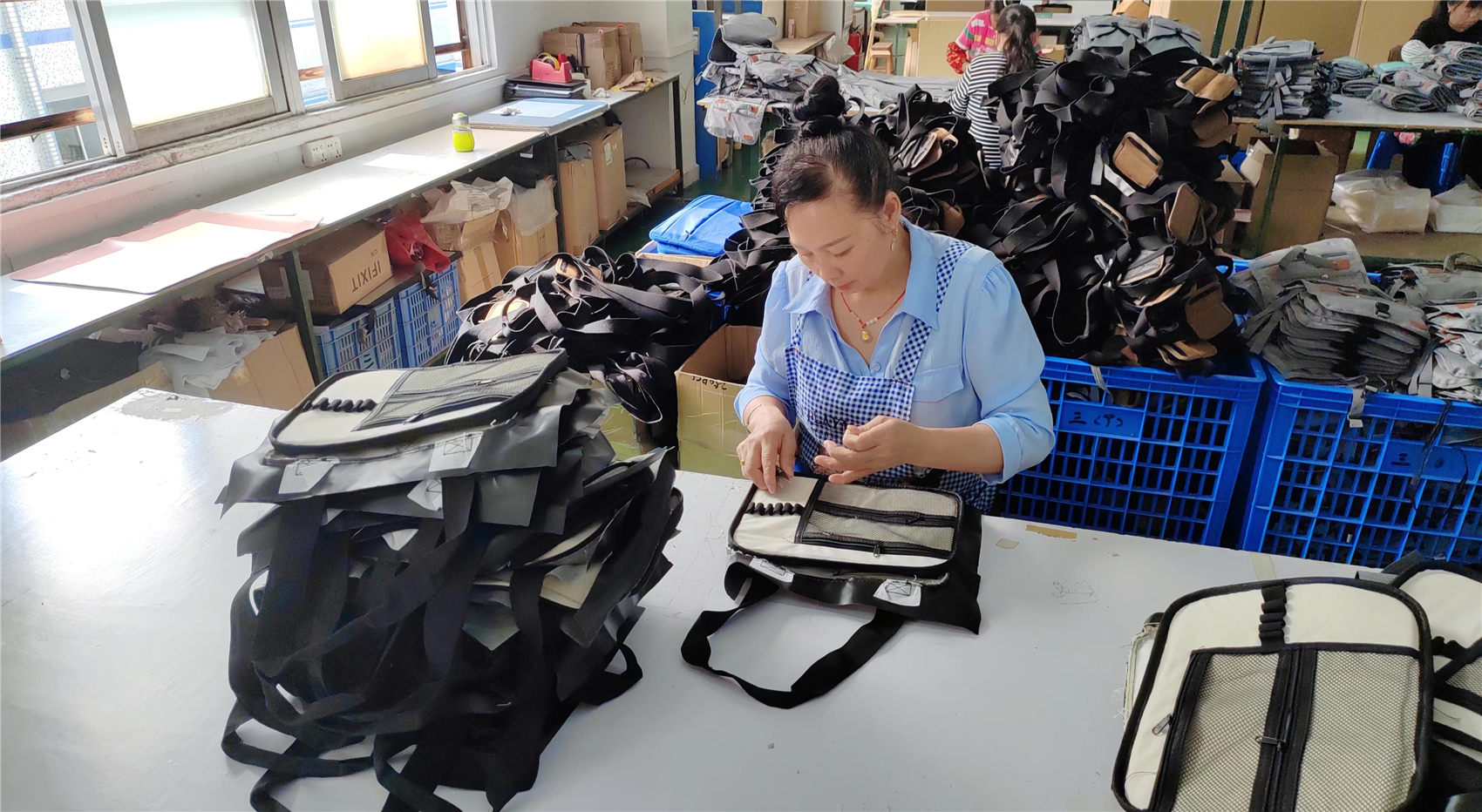 Quality inspection team checking finished bags at Ripped Fashion Co. Ltd