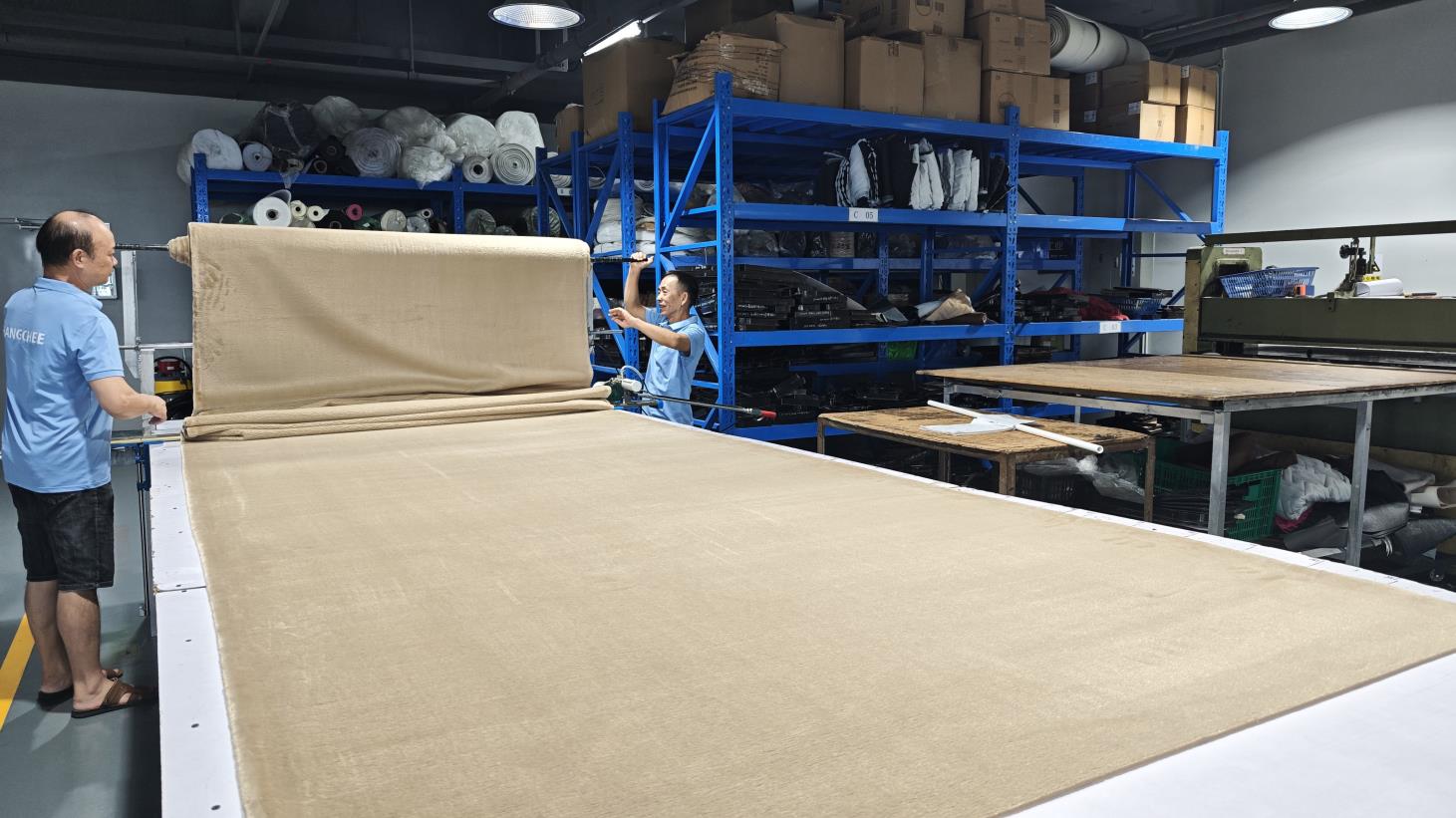 Large cutting table for precision fabric cutting at Ripped Fashion factory