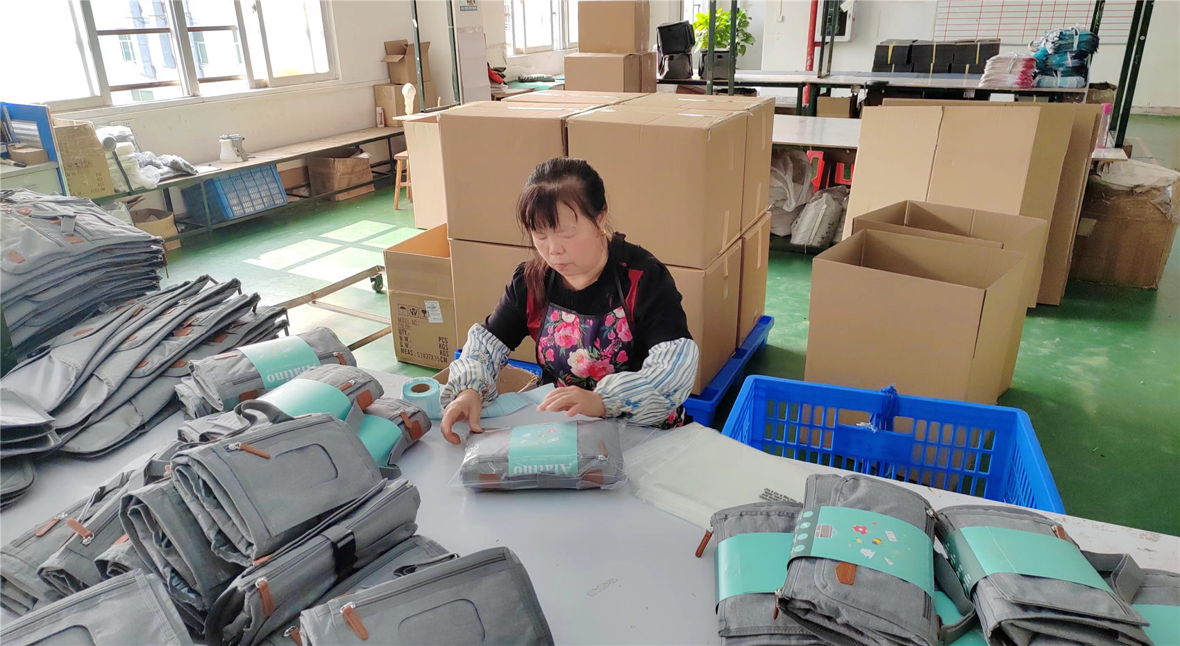 Professional packaging station at Ripped Fashion bag factory in China