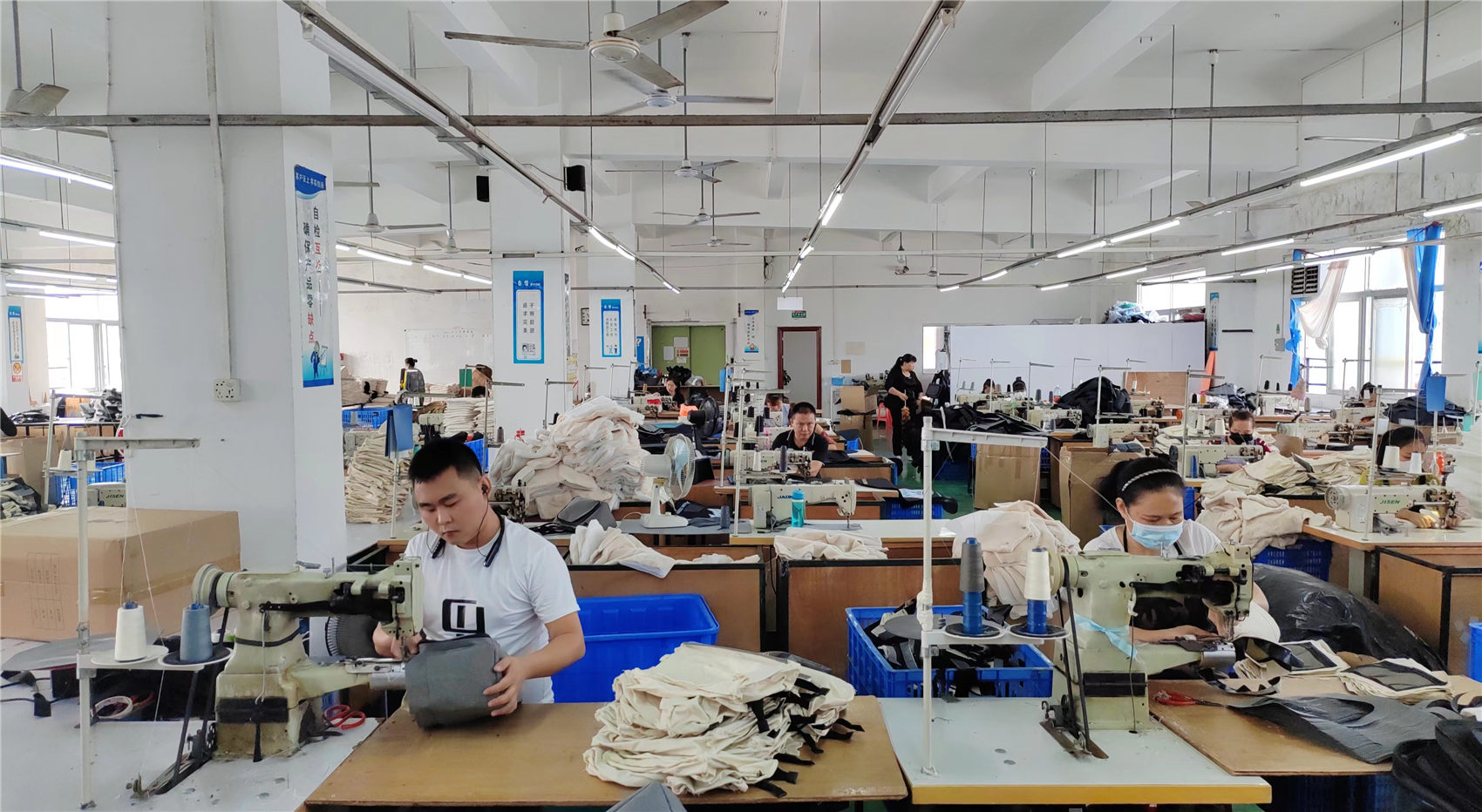 Industrial sewing line at Ripped Fashion bag production workshop Hebei