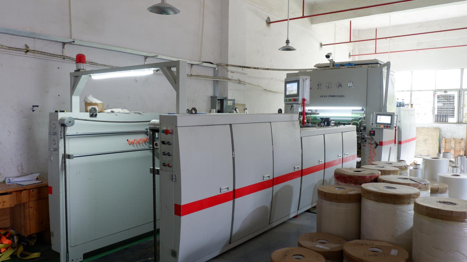 Automatic laminating line for packaging materials at RLL Logistics facility