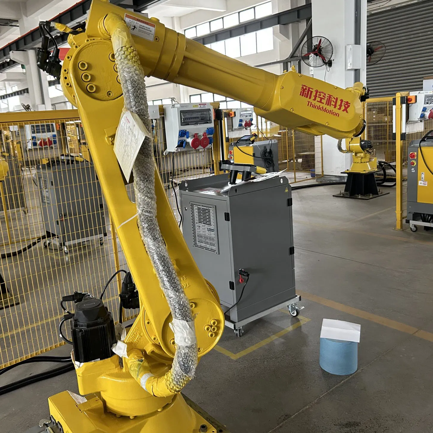 an Electric Industrial Robotic Arm for Automated Welding of Metal Parts