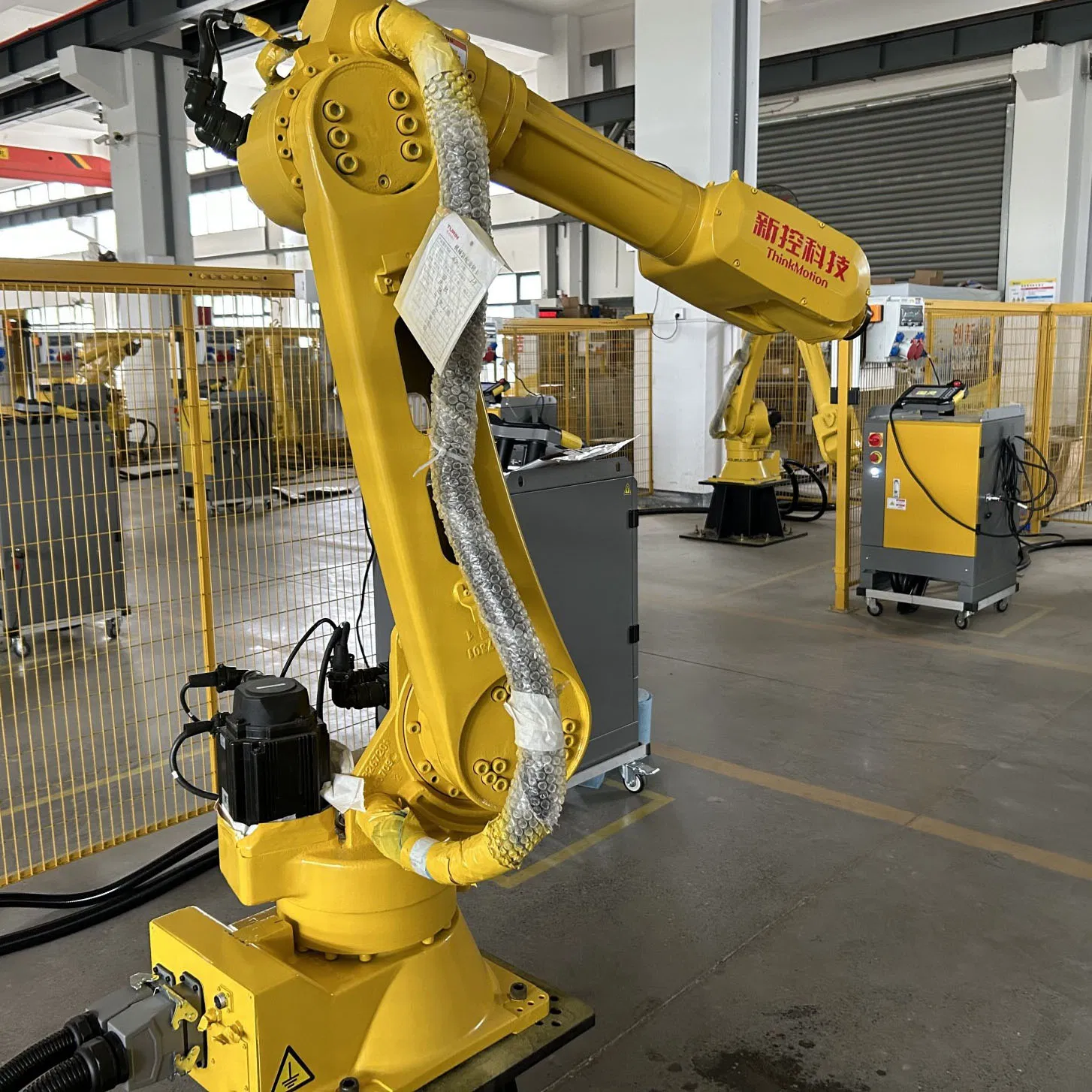 an Electric Industrial Robotic Arm for Automated Welding of Metal Parts