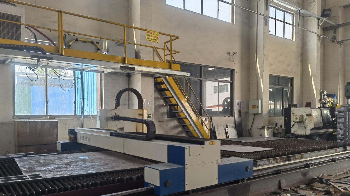 Industrial laser cutting machine in Dalian Mobo Robot production facility