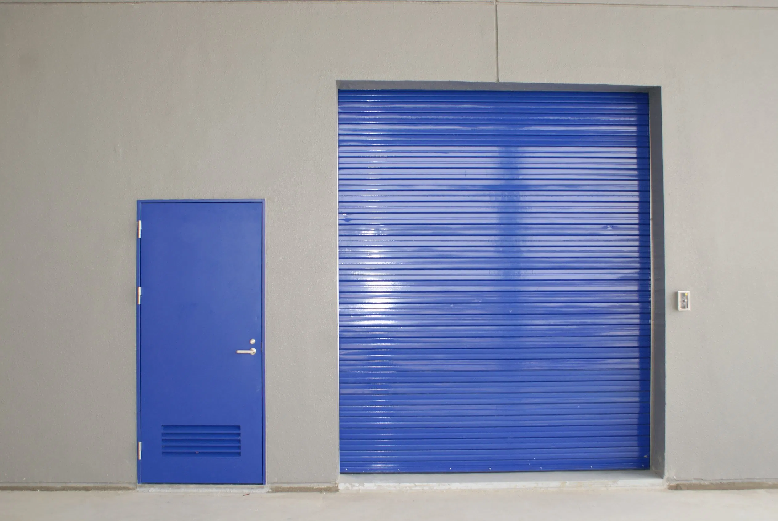 Puerta enrollable de seguridad de acero inoxidable galvanizado industrial a prueba de fuego para interiores