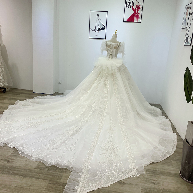 Vestido de novia de bola con apliques de encaje marfil y cuentas para mujeres