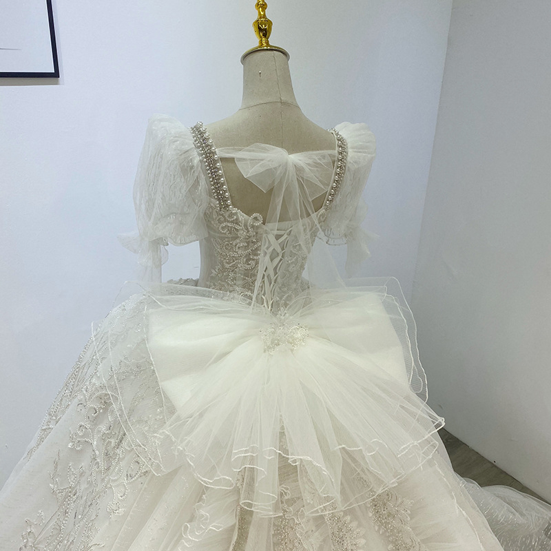 Vestido de novia de bola con apliques de encaje marfil y cuentas para mujeres