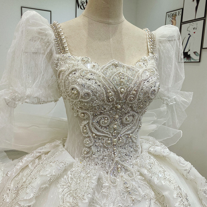 Vestido de novia de bola con apliques de encaje marfil y cuentas para mujeres