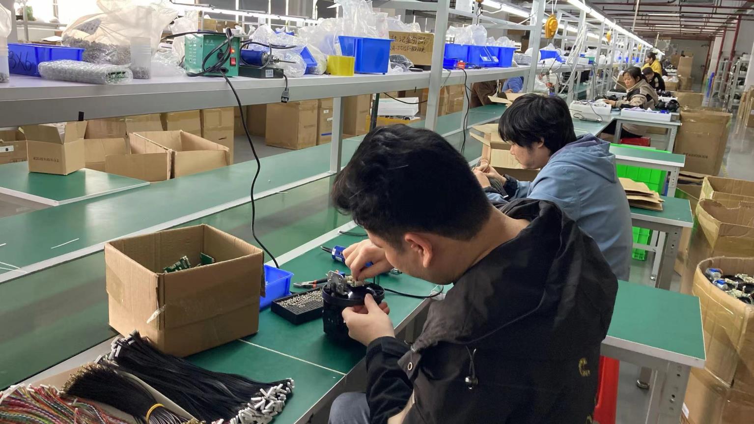 HawkEye Camera skilled technician assembling precision components