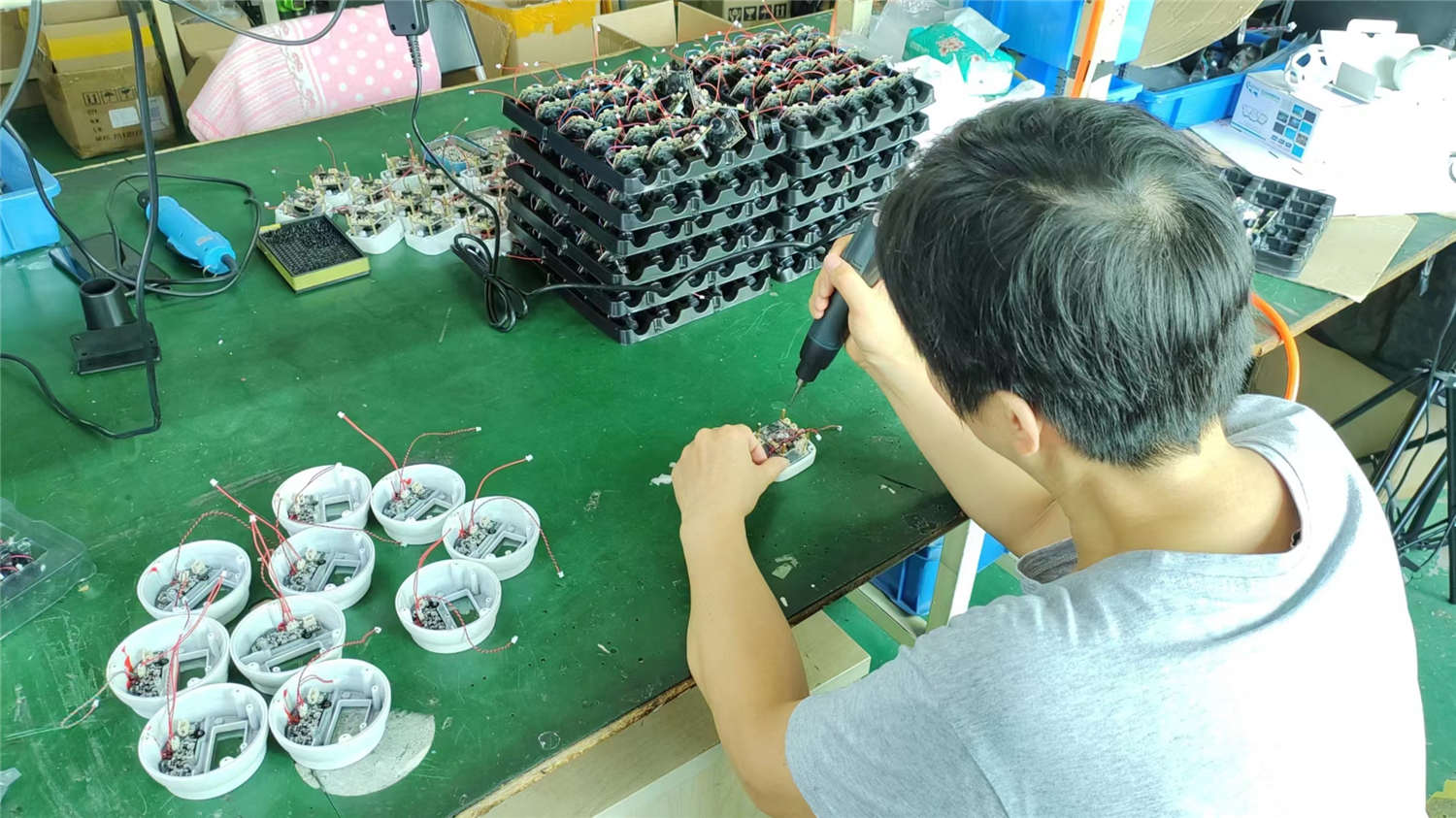 HawkEye Camera factory assembly line — professional product assembly process