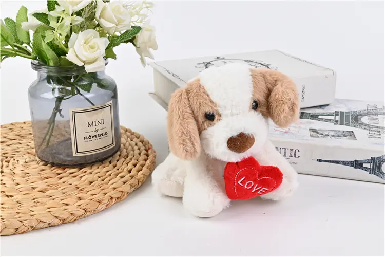 Dog with heart plush toy side view
