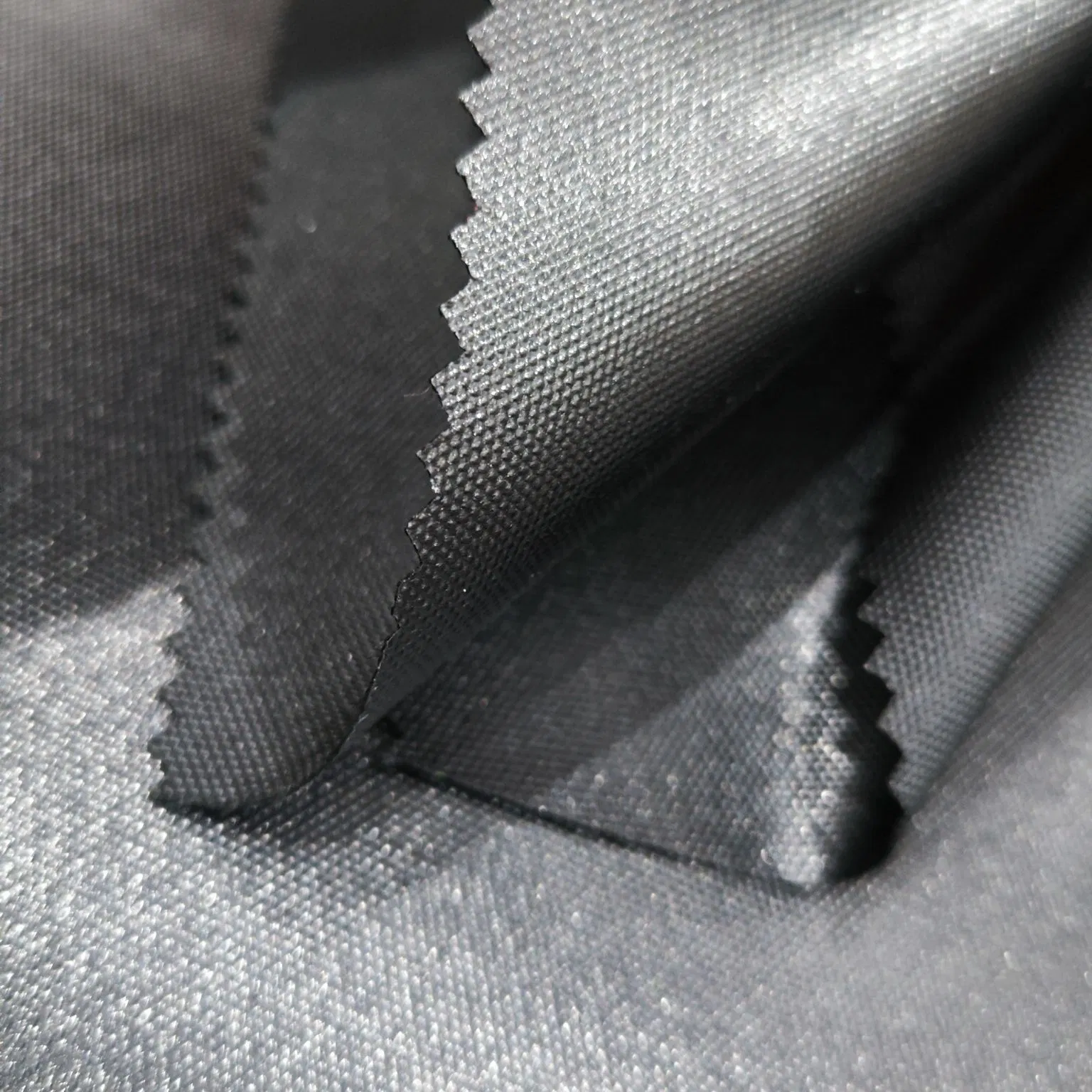 100% Polyester 600d Oxford with Uni-Adhesive Coating Waterproof Blakc Fabric for Luggage
