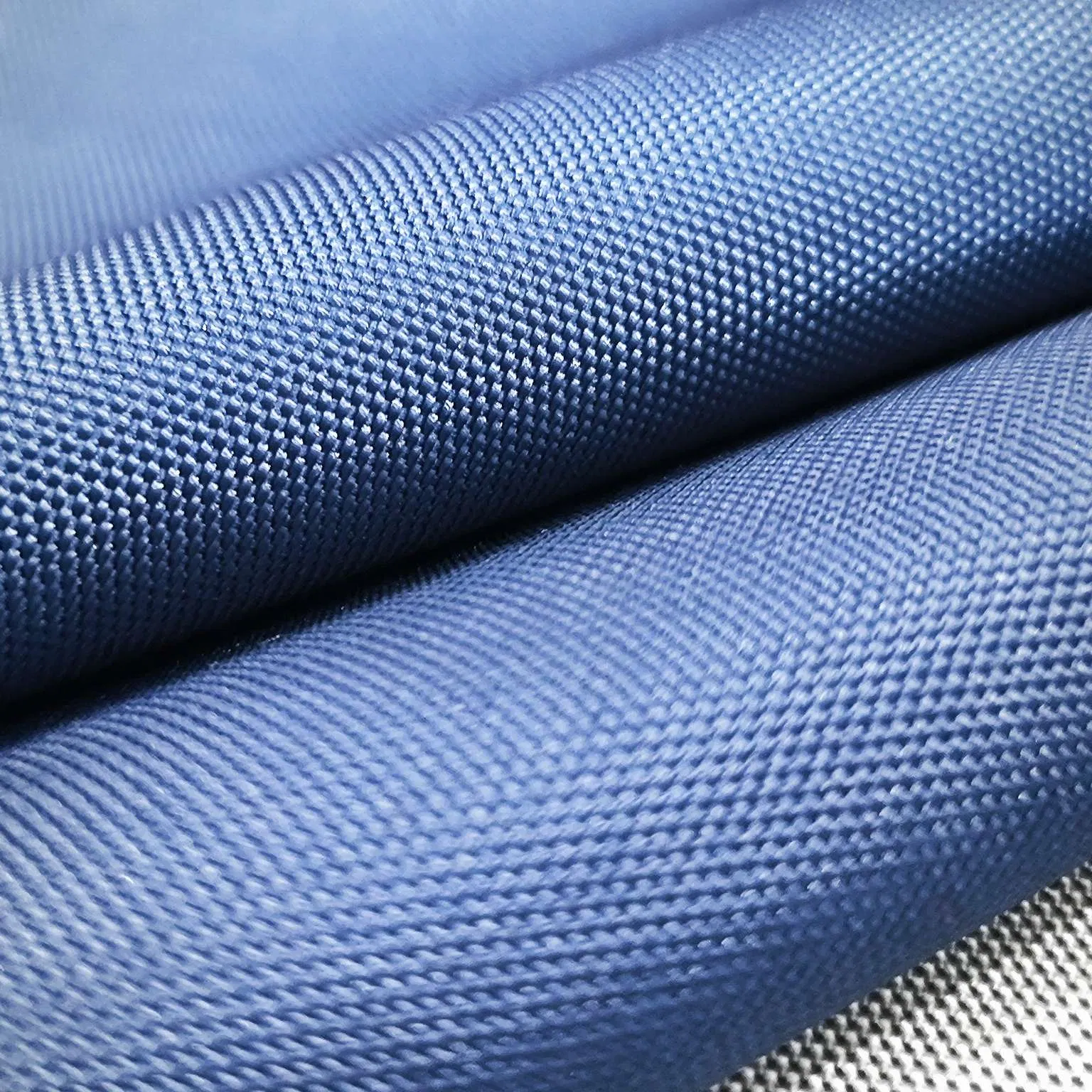 100% Polyester 600d Oxford with Uni-Adhesive Coating Waterproof Navy Fabric for Cases
