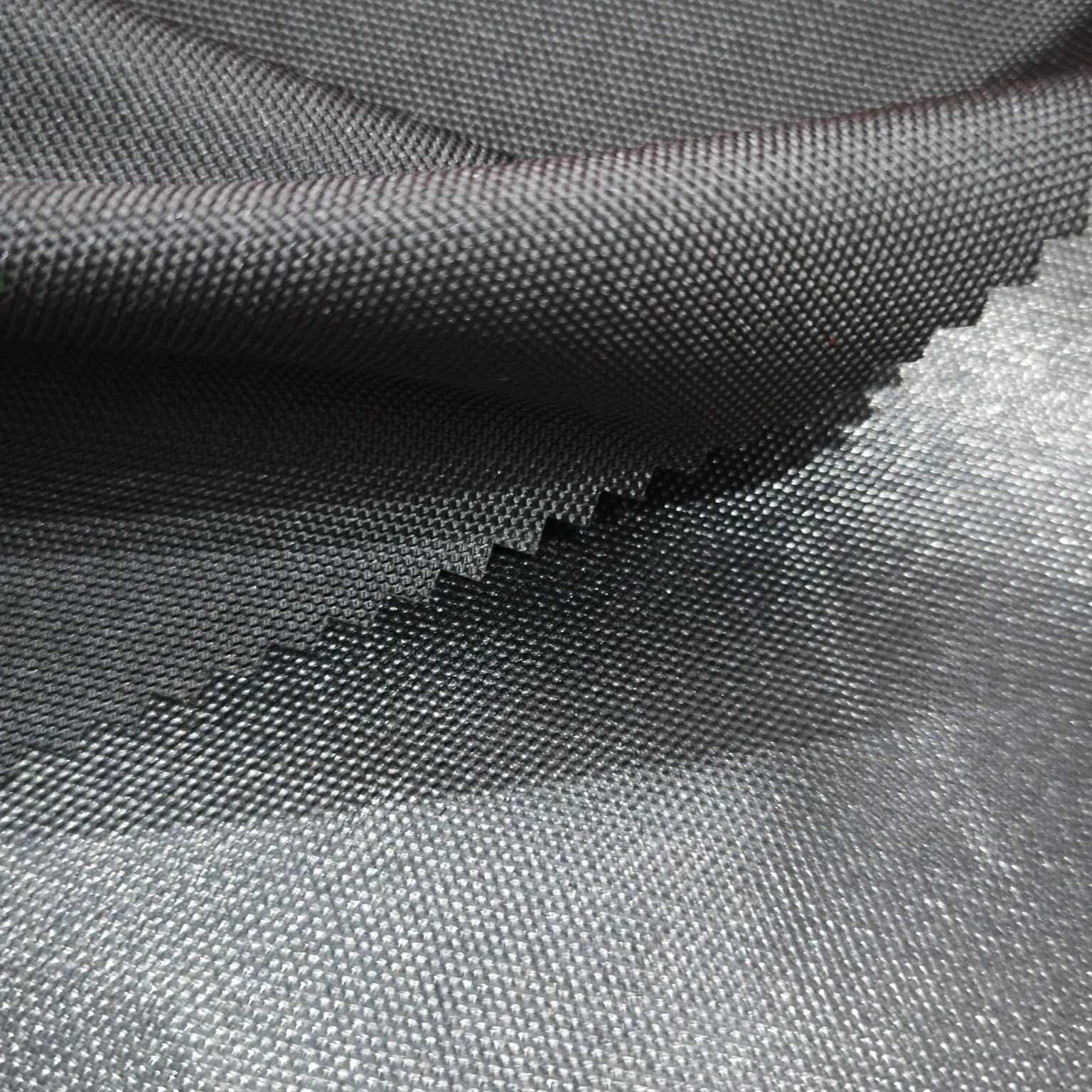 100% Polyester 600d Oxford with Uni-Adhesive Coating Waterproof Blakc Fabric for Luggage