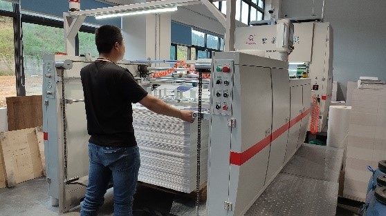 Laminating process — applying protective film layer to PP woven bags for moisture resistance