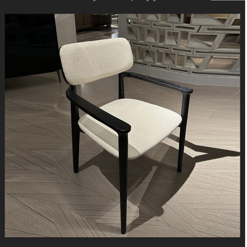 The Reading Nook Dining Chair That Transitions From Dining Table to Living Room Corner with a Cozy Wrapped Back That Feels Enclosing