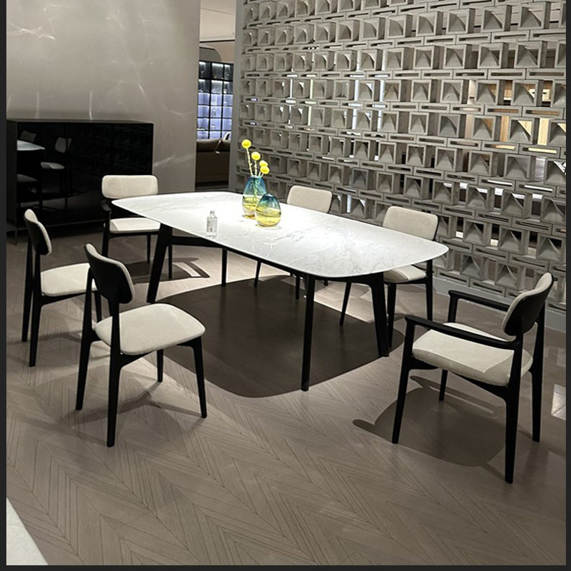 The Reading Nook Dining Chair That Transitions From Dining Table to Living Room Corner with a Cozy Wrapped Back That Feels Enclosing