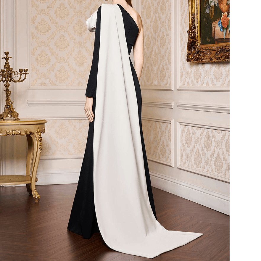 The Monochrome Rose Architectural Gown This striking floor length gown in avant garde tailoring and modern minimalism
