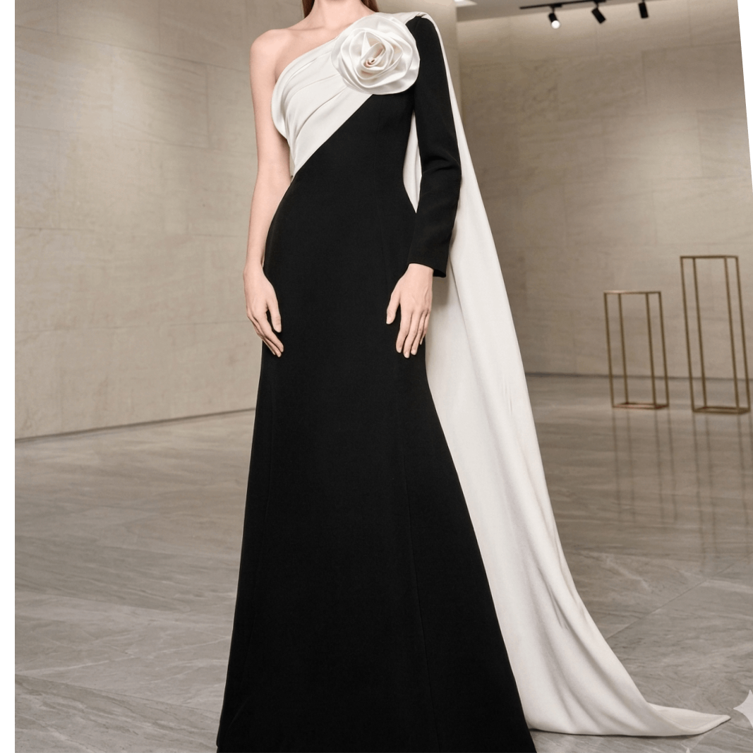 The Monochrome Rose Architectural Gown This striking floor length gown in avant garde tailoring and modern minimalism