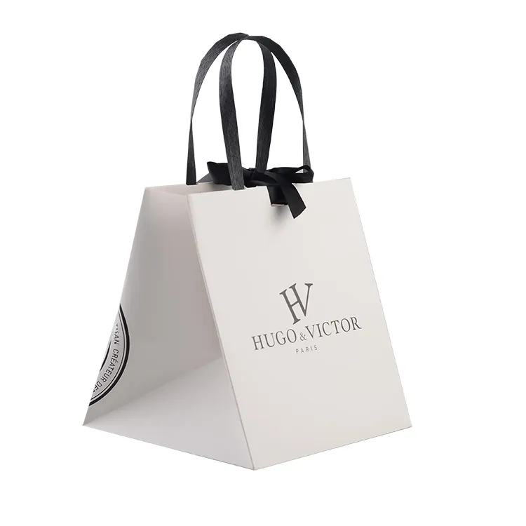Bolsas de compras blancas reutilizables y ecológicas al por mayor, embalaje de papel de lujo personalizado con impresión de logo para joyería, ropa y regalos
