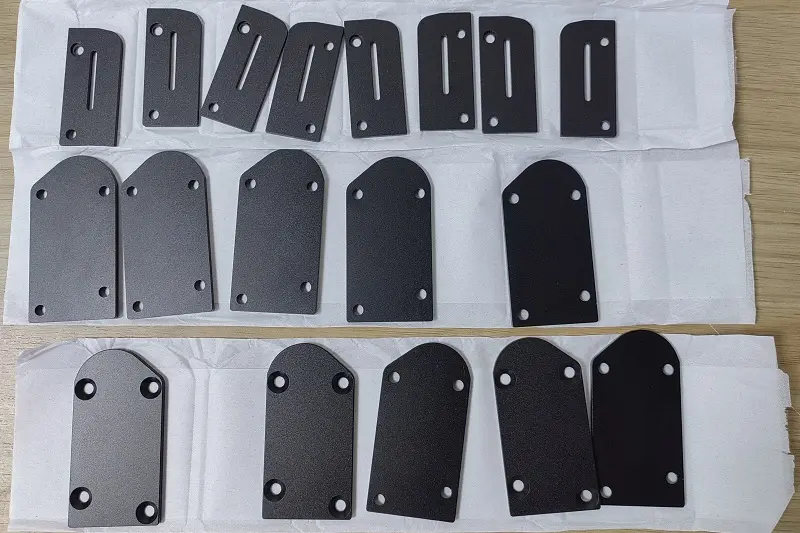 CNC milling machine working on metal block, precise shape cutting