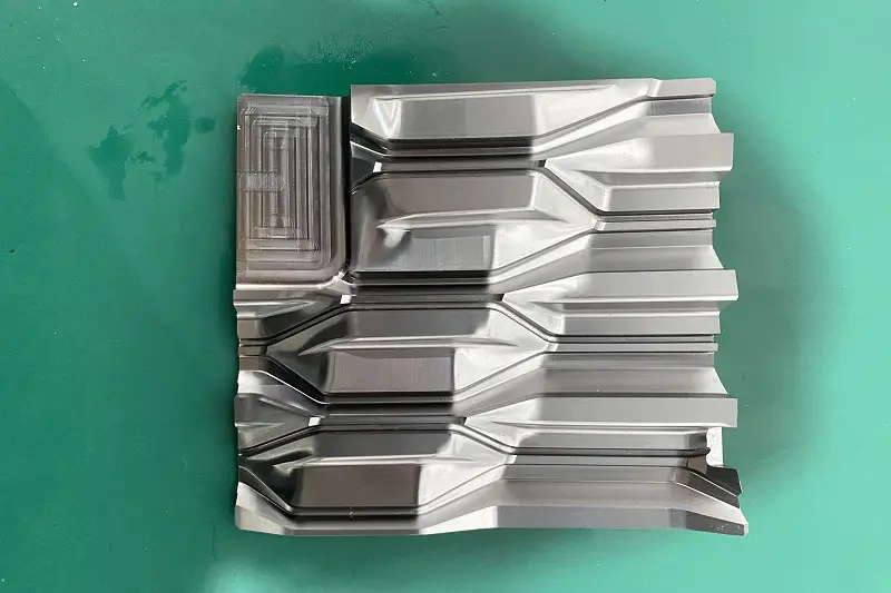 CNC milling machine working on metal sheet, laser cutting combination