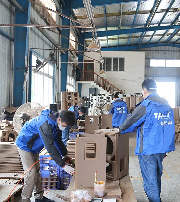 TACT Pro Audio factory floor showcasing speaker cabinet production and assembly workshop