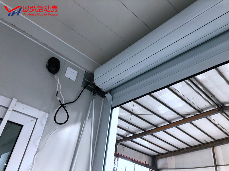 Fashionable Container Booth Roller Shuttle Container with Manual /Electrical Machinery Rolling