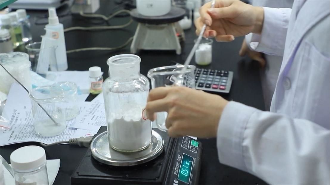 Precision weighing of cosmetics ingredients in TPL Beauty GMP-certified laboratory