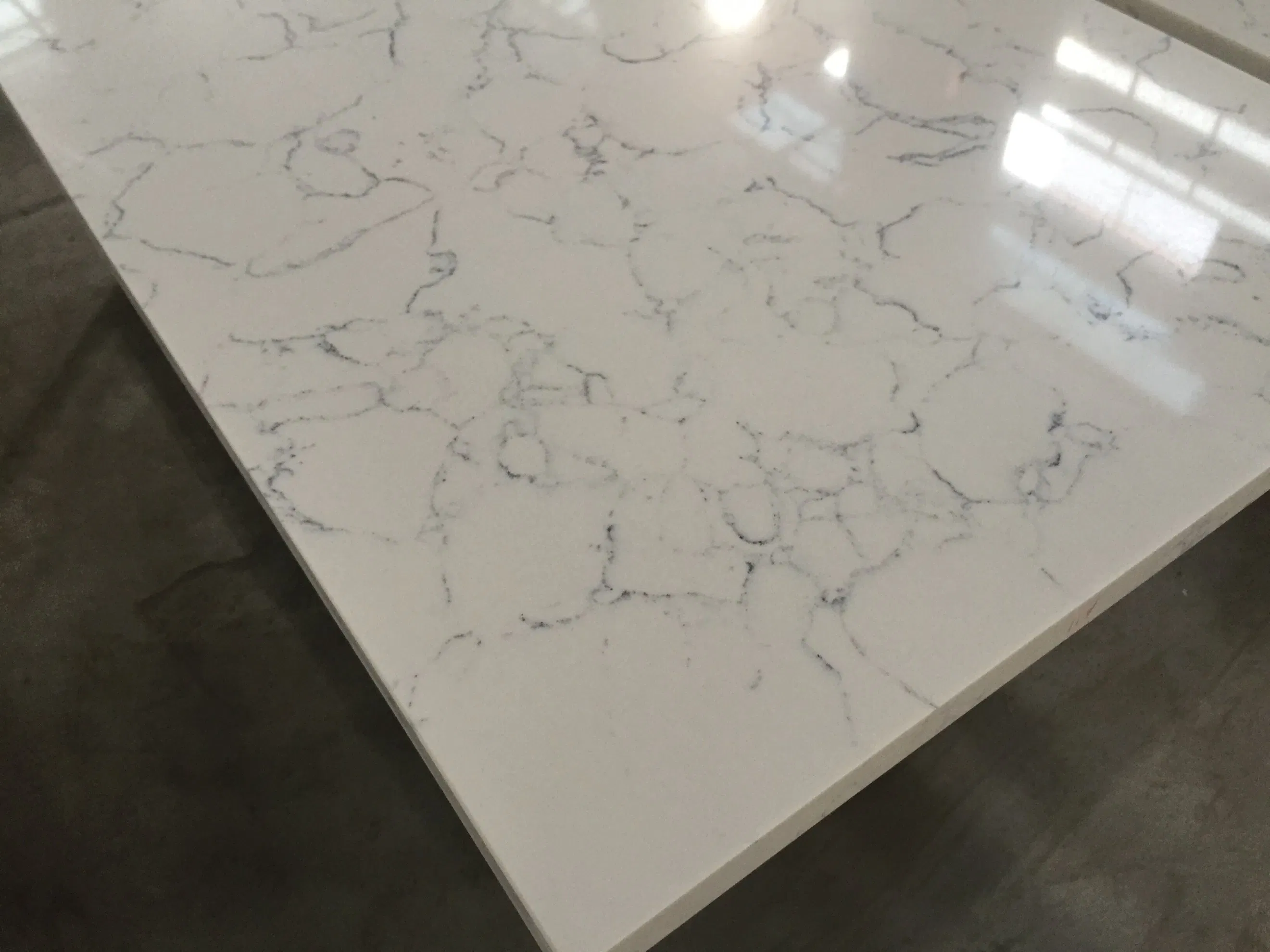 Carrara White Quartz Kitchen Countertops, Dining Tables, and Fireplaces - Custom Artificial Stone Slabs with Marble Aesthetic