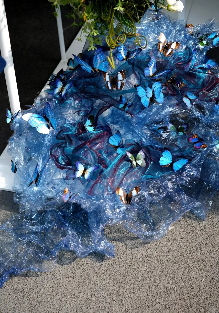 Artificial Greenery Art Installation with Giant Blue Butterflies