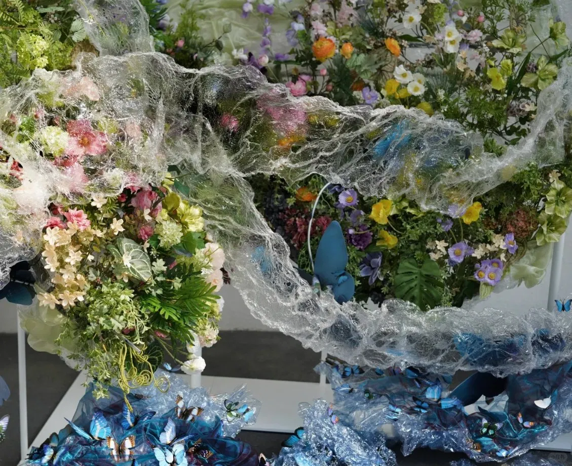 Artificial Greenery Art Installation with Giant Blue Butterflies