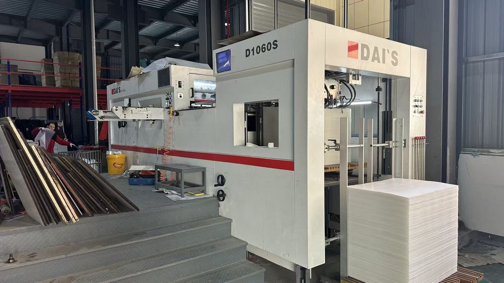 Pressing machine shaping metal sheets for home storage product components