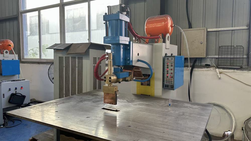 Spot welding machine joining metal components precisely in storage product assembly