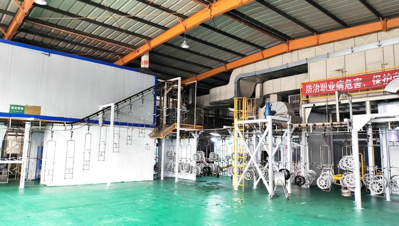 Spraying process for protective coating on truck wheels