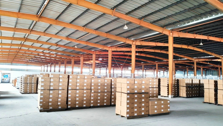 Warehouse storing finished truck wheels ready for global export