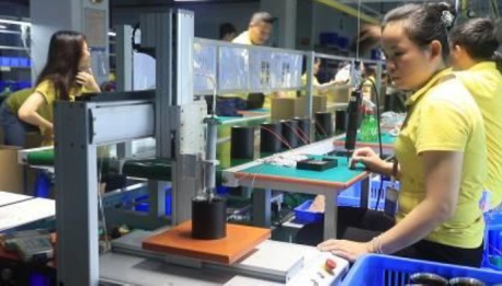 Automated glue dispenser machine used in LED production at Vactrim