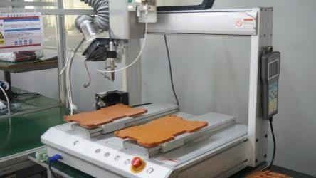Automatic welding machine for precision circuit board manufacturing at V-Cest Beauty factory