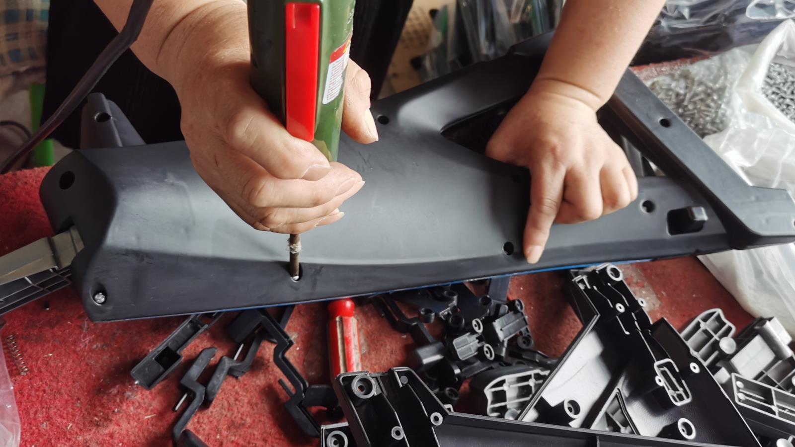 Whoo Toys factory assembly workshop — children's ride-on toy production