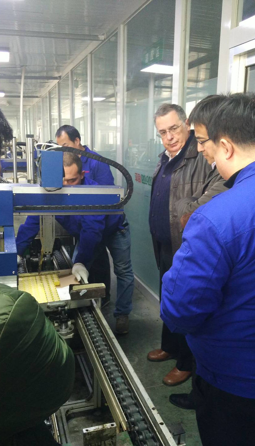 Foreign buyers inspecting transformer production line at Xinping Electric